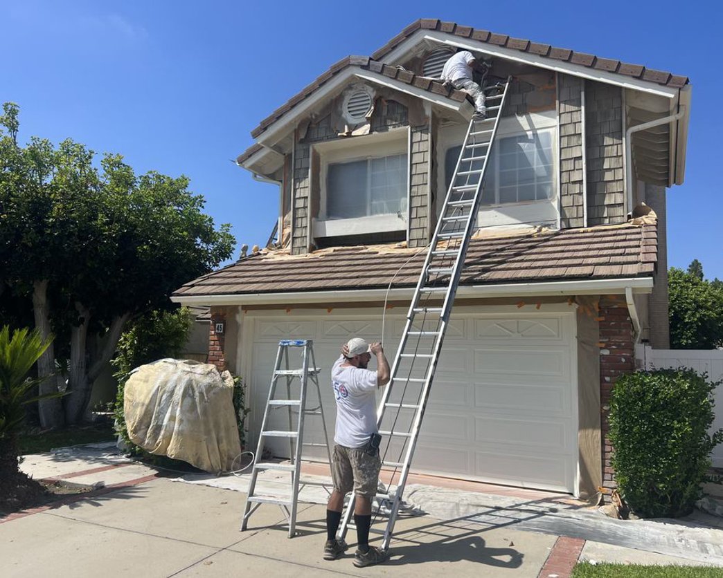 Professional exterior painting team at work Orange County CA